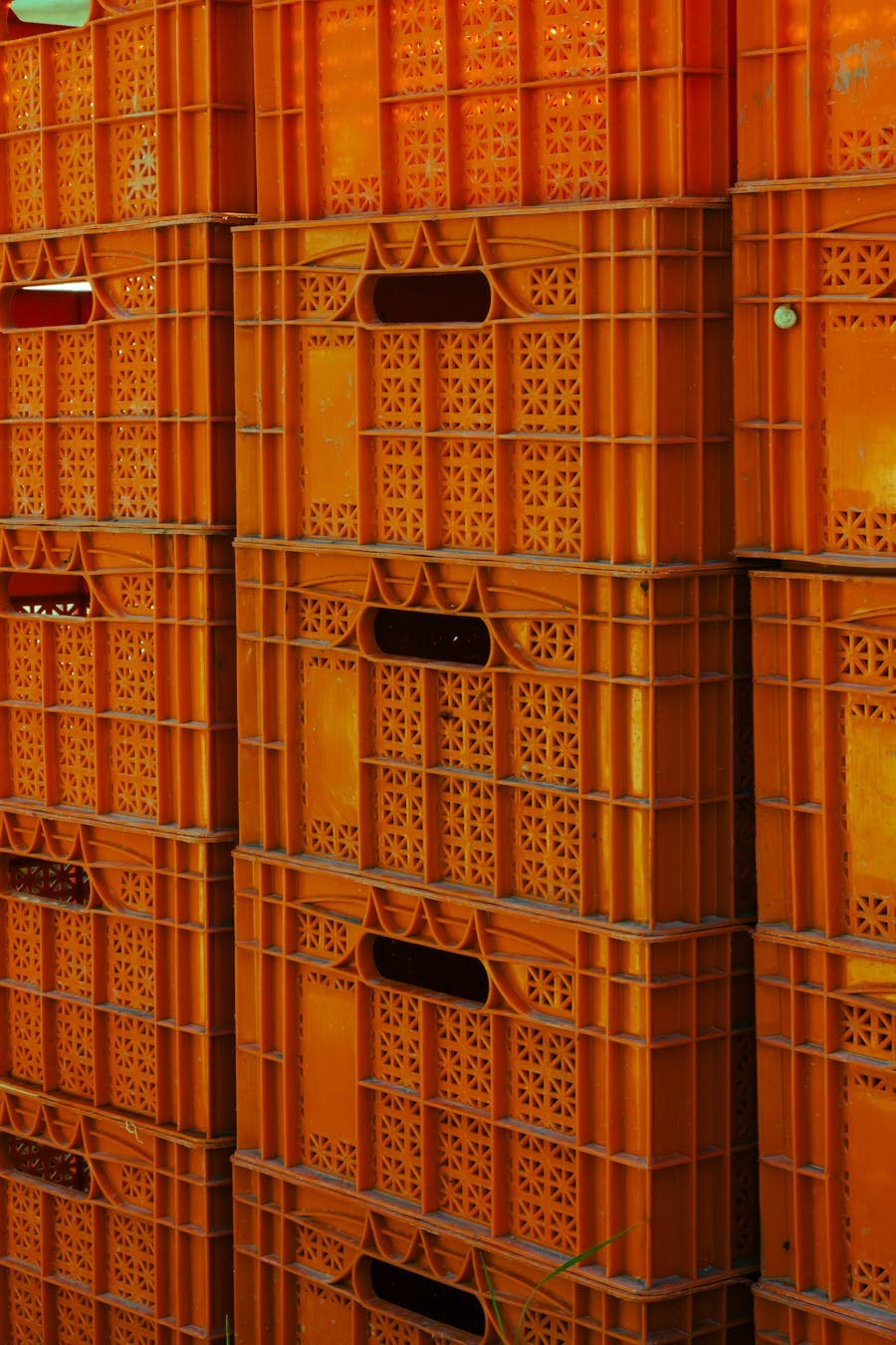 Stacked plastic crates used for industrial storage and packaging