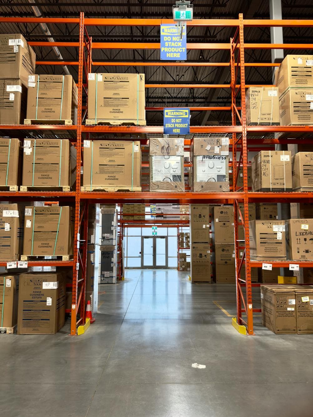 Warehouse racks with packed industrial goods and cartons