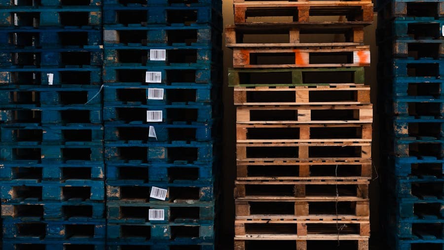 Stacked wooden pallets in a warehouse